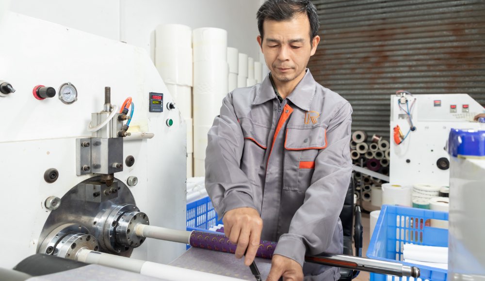 the worker operating the cutting machine